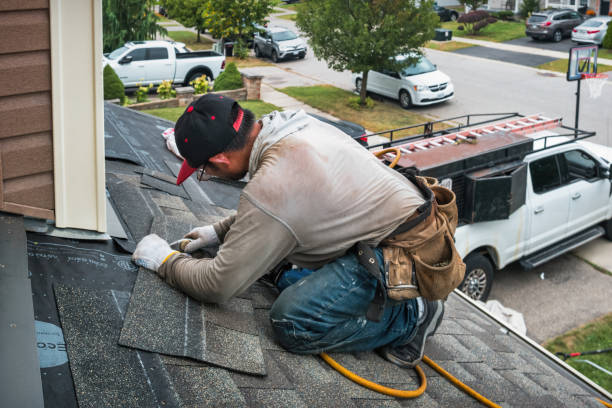 Professional Roofing technician working in Lindenhurst, NY